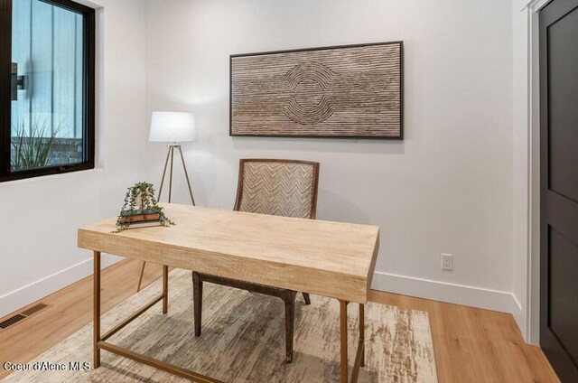 624 Satchel Dr, Spirit Lake, ID 83869 - office area with baseboards and wood finished floors