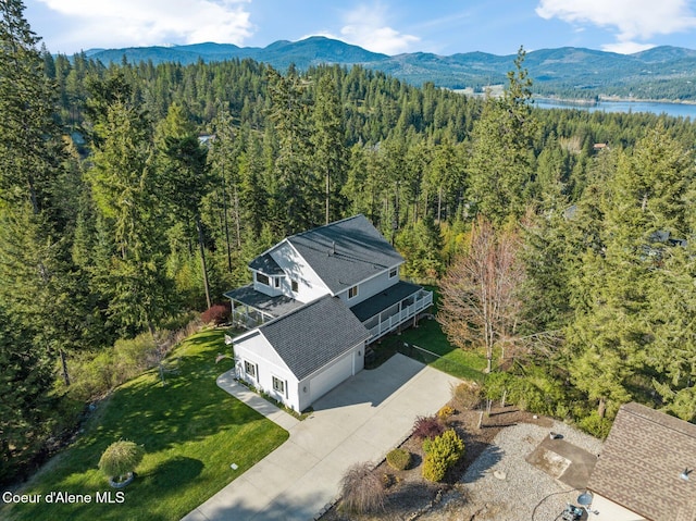 9798 N Willowherb Ct, Hauser, ID 83854 - view of subject property featuring a heavily wooded area and a water and mountain view