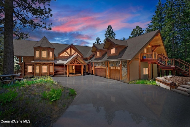 1050 Greenview Ln, Moscow, ID 83843 - view of front of house with stone siding, stairway, and driveway