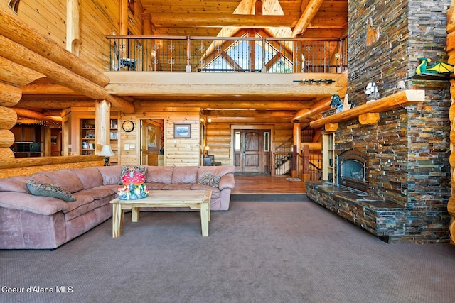 1050 Greenview Ln, Moscow, ID 83843 - living area featuring high vaulted ceiling, carpet floors, beamed ceiling, wooden ceiling, and a stone fireplace