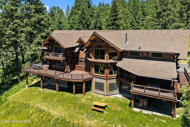1050 Greenview Ln, Moscow, ID 83843 - rear view of property featuring a deck, roof with shingles, a yard, and a balcony