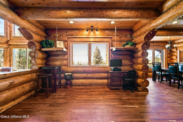 1050 Greenview Ln, Moscow, ID 83843 - living area featuring wood finished floors, rustic walls, and beamed ceiling