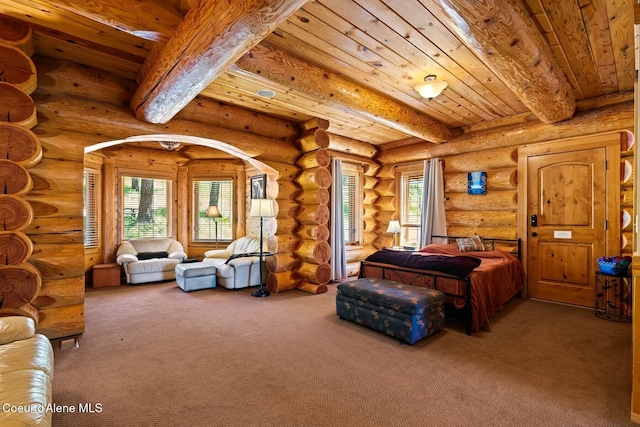 1050 Greenview Ln, Moscow, ID 83843 - bedroom with beamed ceiling, carpet floors, wood ceiling, multiple windows, and rustic walls