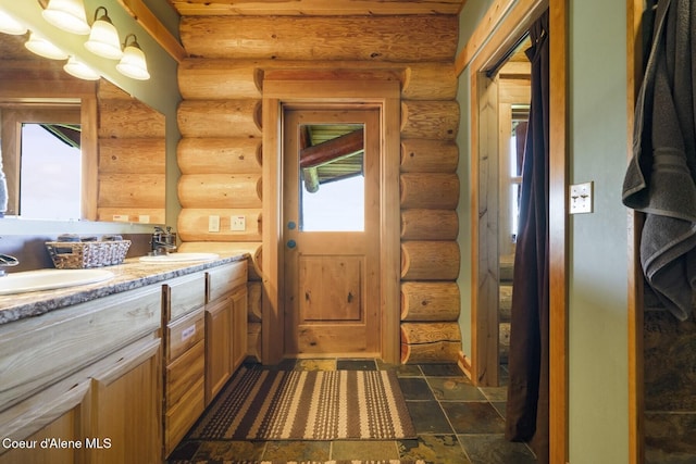 1050 Greenview Ln, Moscow, ID 83843 - washroom featuring log walls, a sink, and plenty of natural light