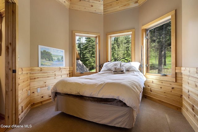 1050 Greenview Ln, Moscow, ID 83843 - carpeted bedroom with wood walls and wainscoting