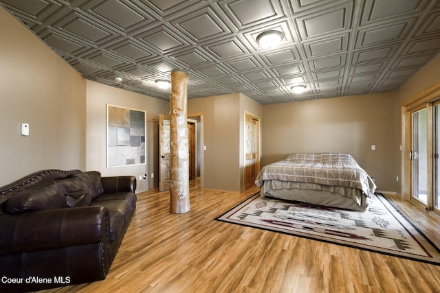1050 Greenview Ln, Moscow, ID 83843 - bedroom featuring an ornate ceiling, wood finished floors, and baseboards