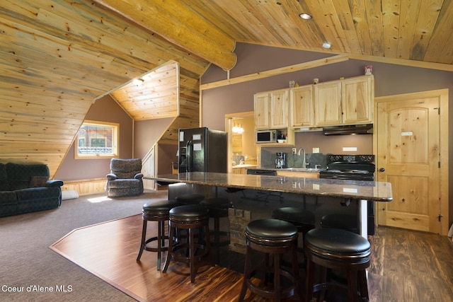 1050 Greenview Ln, Moscow, ID 83843 - kitchen featuring black appliances, wood ceiling, under cabinet range hood, lofted ceiling, and light brown cabinetry