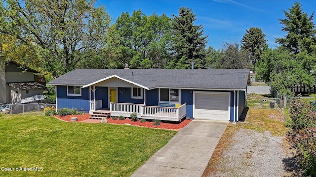 4413 W Pleasant Ln, Post Falls, ID 83854 - single story home with a garage, concrete driveway, a porch, and a shingled roof