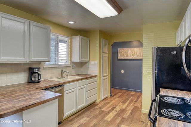 4413 W Pleasant Ln, Post Falls, ID 83854 - kitchen featuring wood counters, stainless steel appliances, a sink, light wood-style floors, and white cabinets