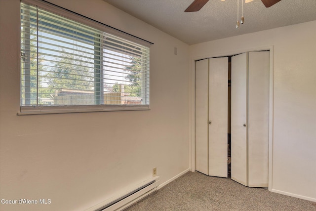 4413 W Pleasant Ln, Post Falls, ID 83854 - unfurnished bedroom with carpet floors, a closet, baseboards, a textured ceiling, and a ceiling fan