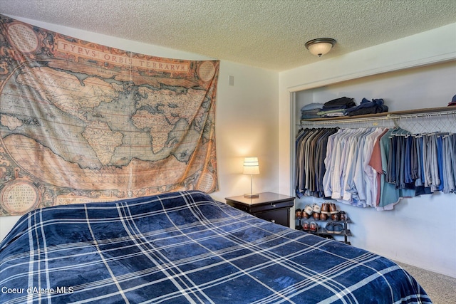 4413 W Pleasant Ln, Post Falls, ID 83854 - carpeted bedroom featuring a textured ceiling and a closet
