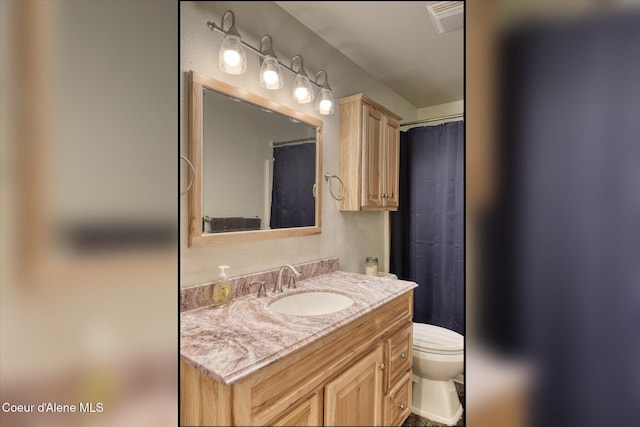 4413 W Pleasant Ln, Post Falls, ID 83854 - bathroom featuring toilet and vanity