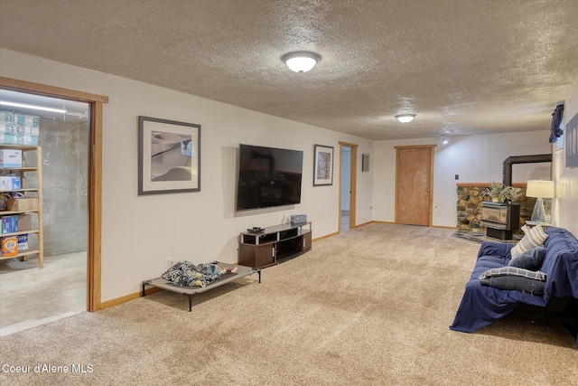 4413 W Pleasant Ln, Post Falls, ID 83854 - carpeted living area featuring a wood stove, baseboards, and a textured ceiling