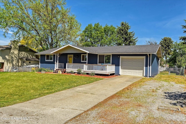 4413 W Pleasant Ln, Post Falls, ID 83854 - single story home featuring a porch, a garage, concrete driveway, and a shingled roof