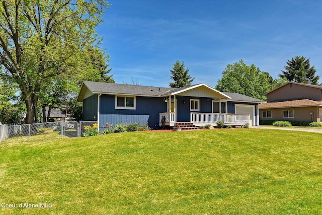 4413 W Pleasant Ln, Post Falls, ID 83854 - ranch-style home with a garage, covered porch, and driveway