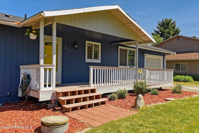 4413 W Pleasant Ln, Post Falls, ID 83854 - view of front of property with covered porch and an attached garage