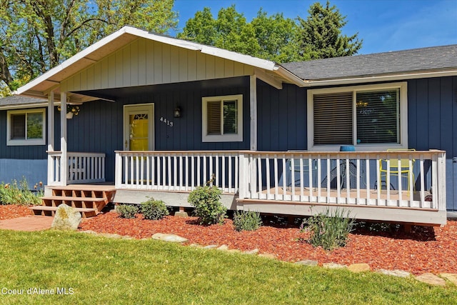 4413 W Pleasant Ln, Post Falls, ID 83854 - view of front of home featuring roof with shingles and a porch