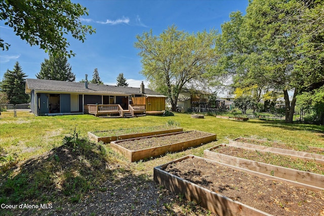 4413 W Pleasant Ln, Post Falls, ID 83854 - view of yard with a garden and a deck