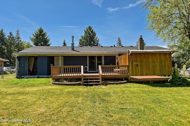 4413 W Pleasant Ln, Post Falls, ID 83854 - rear view of property with a deck, a yard, and a chimney