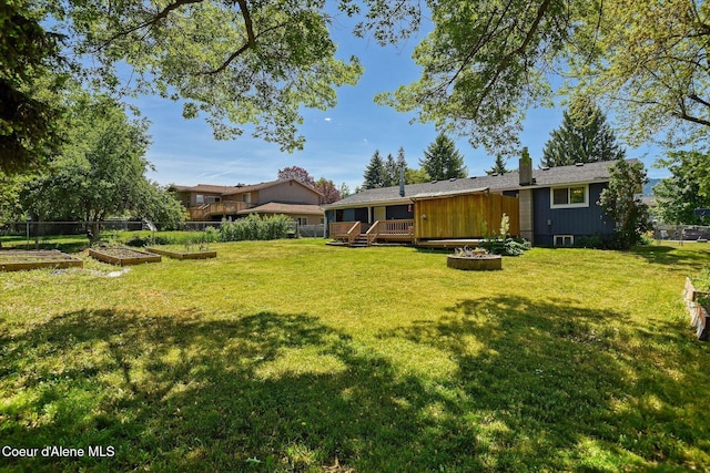4413 W Pleasant Ln, Post Falls, ID 83854 - view of yard with a garden and a deck