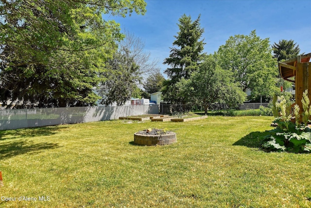 4413 W Pleasant Ln, Post Falls, ID 83854 - view of yard featuring an outdoor fire pit