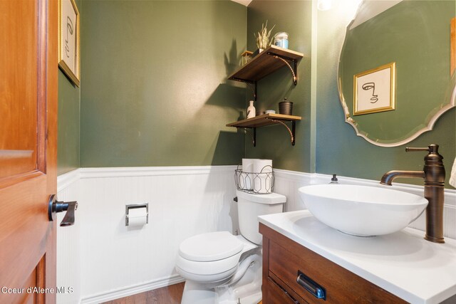 11624 N W Newman Lake Dr, Newman Lake, WA 99025 - half bath featuring wainscoting, toilet, vanity, and wood finished floors