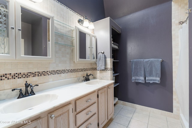11624 N W Newman Lake Dr, Newman Lake, WA 99025 - bathroom featuring tile patterned floors, double vanity, and baseboards