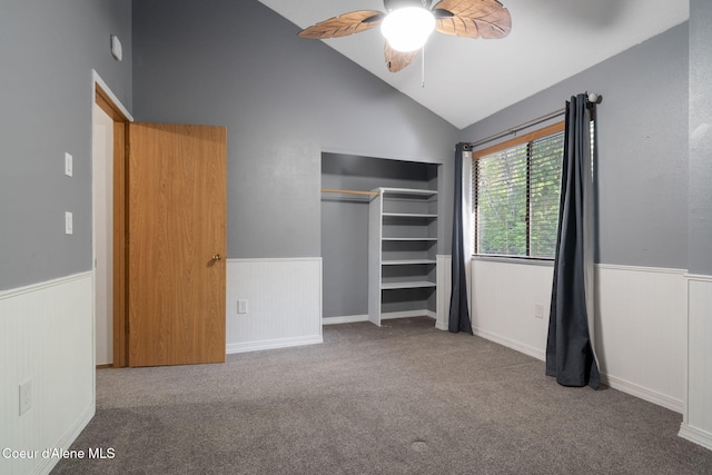 11624 N W Newman Lake Dr, Newman Lake, WA 99025 - unfurnished bedroom featuring a wainscoted wall, carpet, a closet, a ceiling fan, and high vaulted ceiling