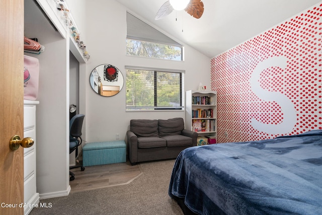 11624 N W Newman Lake Dr, Newman Lake, WA 99025 - carpeted bedroom with vaulted ceiling, an accent wall, a ceiling fan, and baseboards