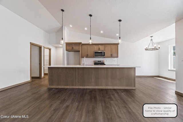 LT6BLK1 E Valley St, Oldtown, ID 83822 - kitchen with stainless steel appliances, dark wood-style floors, backsplash, light countertops, and recessed lighting