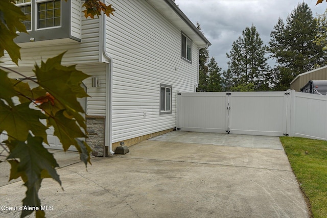3168 N 9th St, Coeur Dalene, ID 83815 - view of home's exterior featuring a gate and a patio