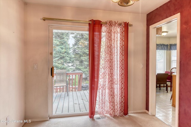 3168 N 9th St, Coeur Dalene, ID 83815 - doorway to outside with healthy amount of natural light, carpet, and baseboards