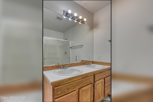 3168 N 9th St, Coeur Dalene, ID 83815 - bathroom with a shower with shower door and double vanity