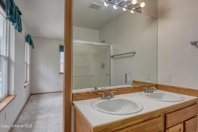 3168 N 9th St, Coeur Dalene, ID 83815 - bathroom with a shower with shower door and double vanity