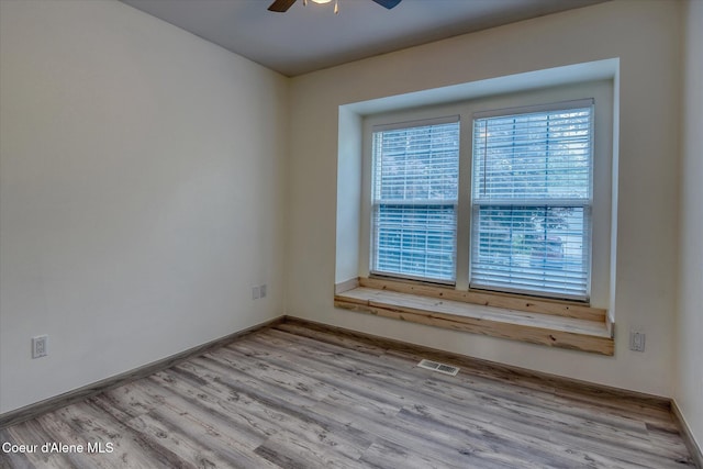 3168 N 9th St, Coeur Dalene, ID 83815 - unfurnished room featuring a ceiling fan, wood finished floors, and baseboards