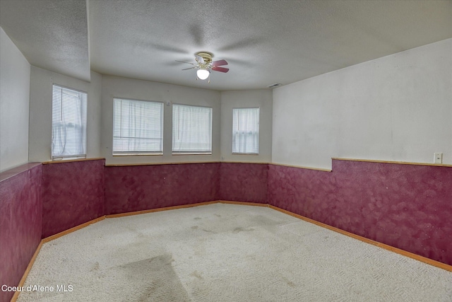 3168 N 9th St, Coeur Dalene, ID 83815 - carpeted empty room featuring a ceiling fan, a textured ceiling, and baseboards
