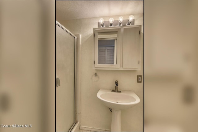 3168 N 9th St, Coeur Dalene, ID 83815 - bathroom featuring a stall shower and a sink