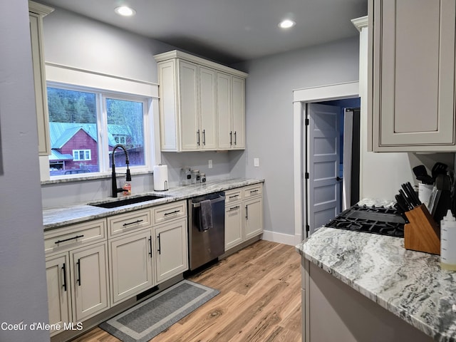 117 River St, Wallace, ID 83873 - kitchen with dishwasher, a sink, light wood-type flooring, recessed lighting, and light stone countertops