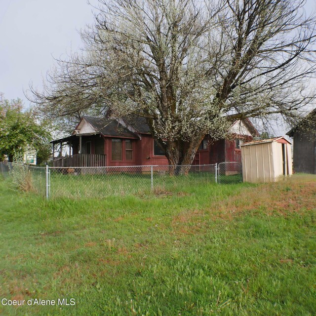 10 3rd St, Fernwood, ID 83830 - fenced yard with a shed and an outbuilding