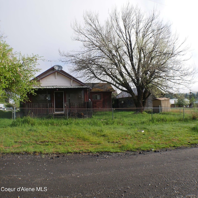 10 3rd St, Fernwood, ID 83830 - view of property exterior with a fenced front yard and a porch