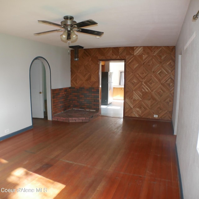 10 3rd St, Fernwood, ID 83830 - unfurnished living room with a ceiling fan and wood finished floors