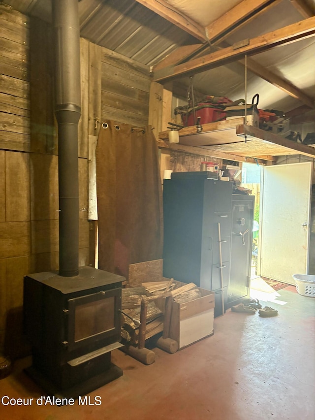 235 S 5th St, Saint Maries, ID 83861 - basement featuring a wood stove and wood walls