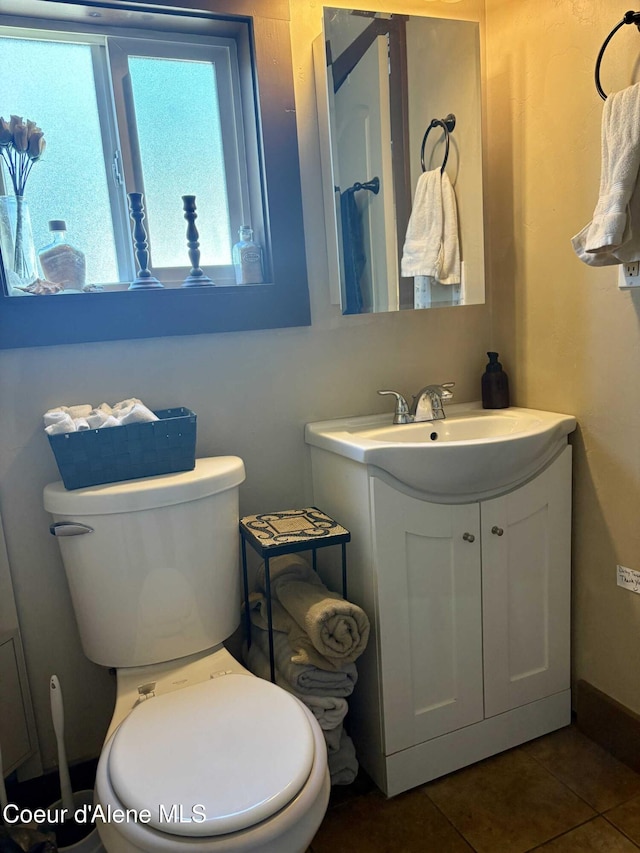 235 S 5th St, Saint Maries, ID 83861 - bathroom with tile patterned flooring, vanity, and toilet