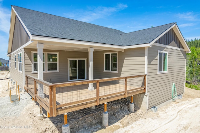 204 Silver Saddle Ct, Pinehurst, ID 83850 - back of property featuring board and batten siding, a shingled roof, and a wooden deck