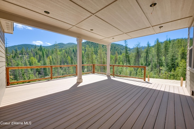 204 Silver Saddle Ct, Pinehurst, ID 83850 - wooden deck featuring a forest view and a mountain view