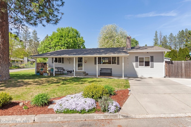 single story home featuring concrete driveway and a porch