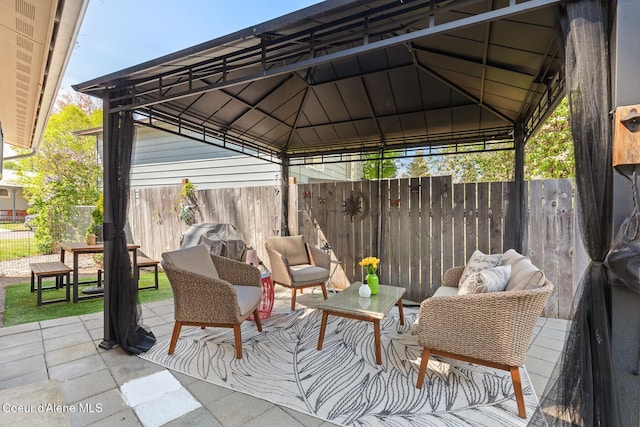 view of patio / terrace with a gazebo and fence