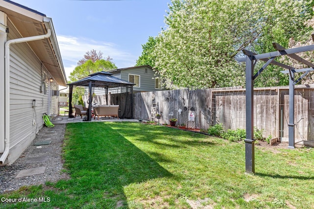 view of yard with a gazebo, a patio area, and an outdoor hangout area