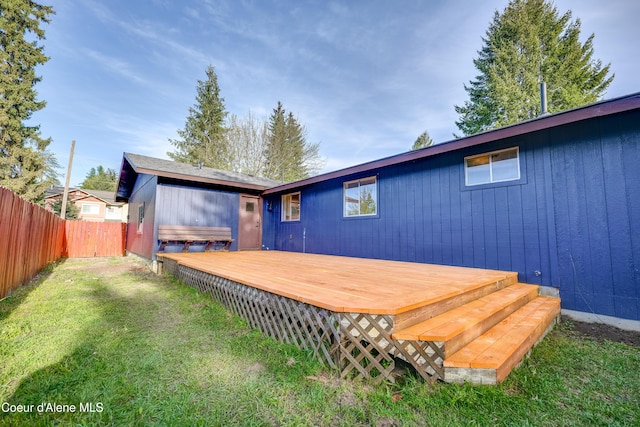 back of property with a wooden deck