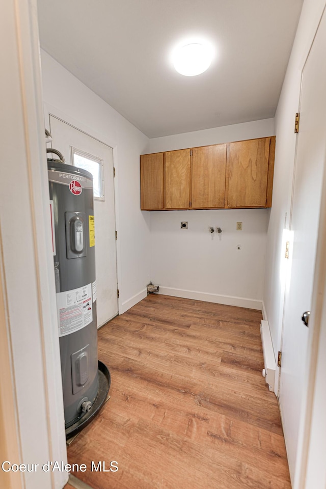 laundry room with cabinet space, water heater, light wood-style flooring, a baseboard heating unit, and washer hookup